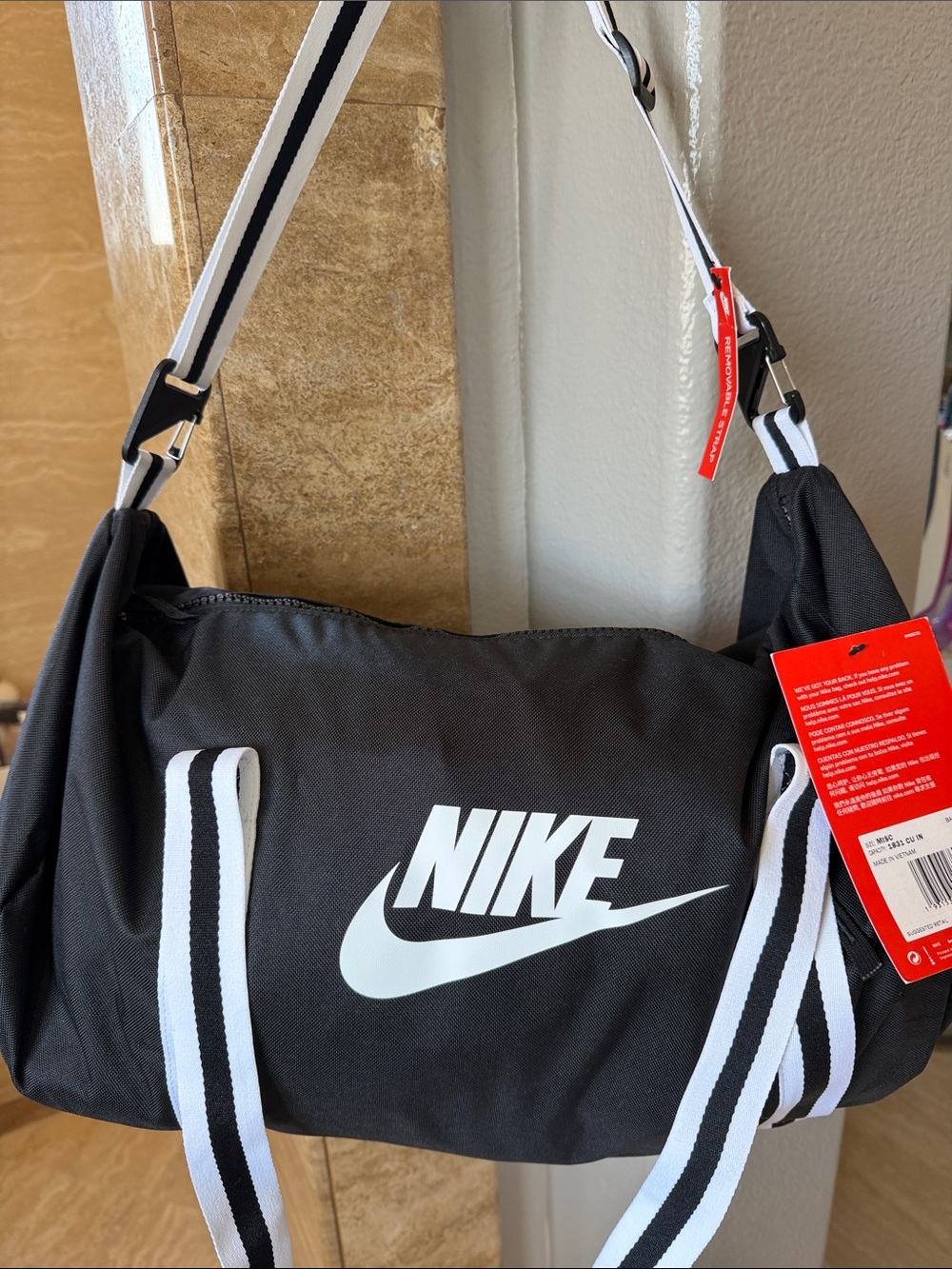 Nike Black Duffel Bag with White Swoosh and Striped Straps men’s gym sports